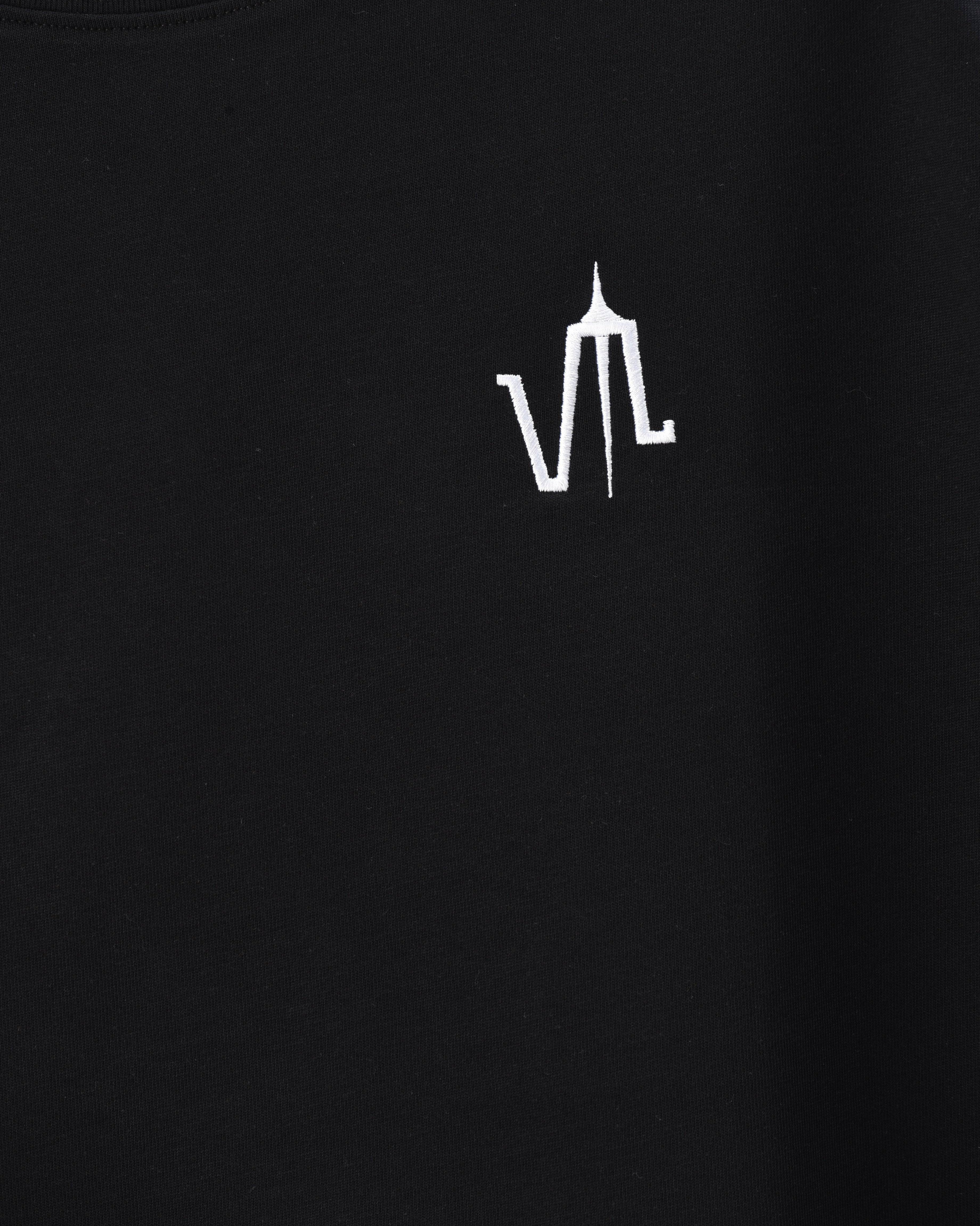 A black t-shirt with the "lubchonak" logo embroidered on the front, close-up.