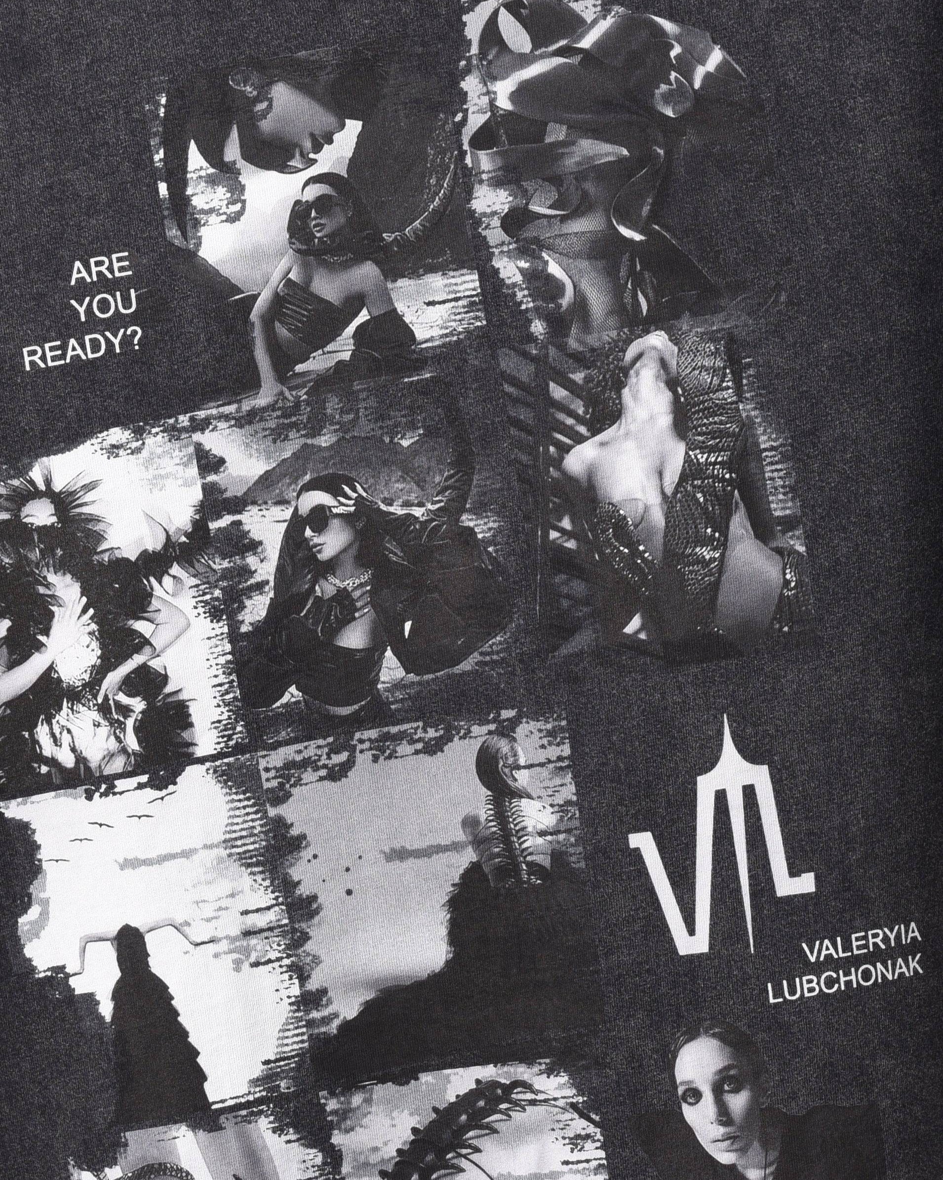 An acid wash black colored t-shirt, viewed from the front, with a big print of a photo montage and elements of the brand Valeryia Lubchonak, close-up.