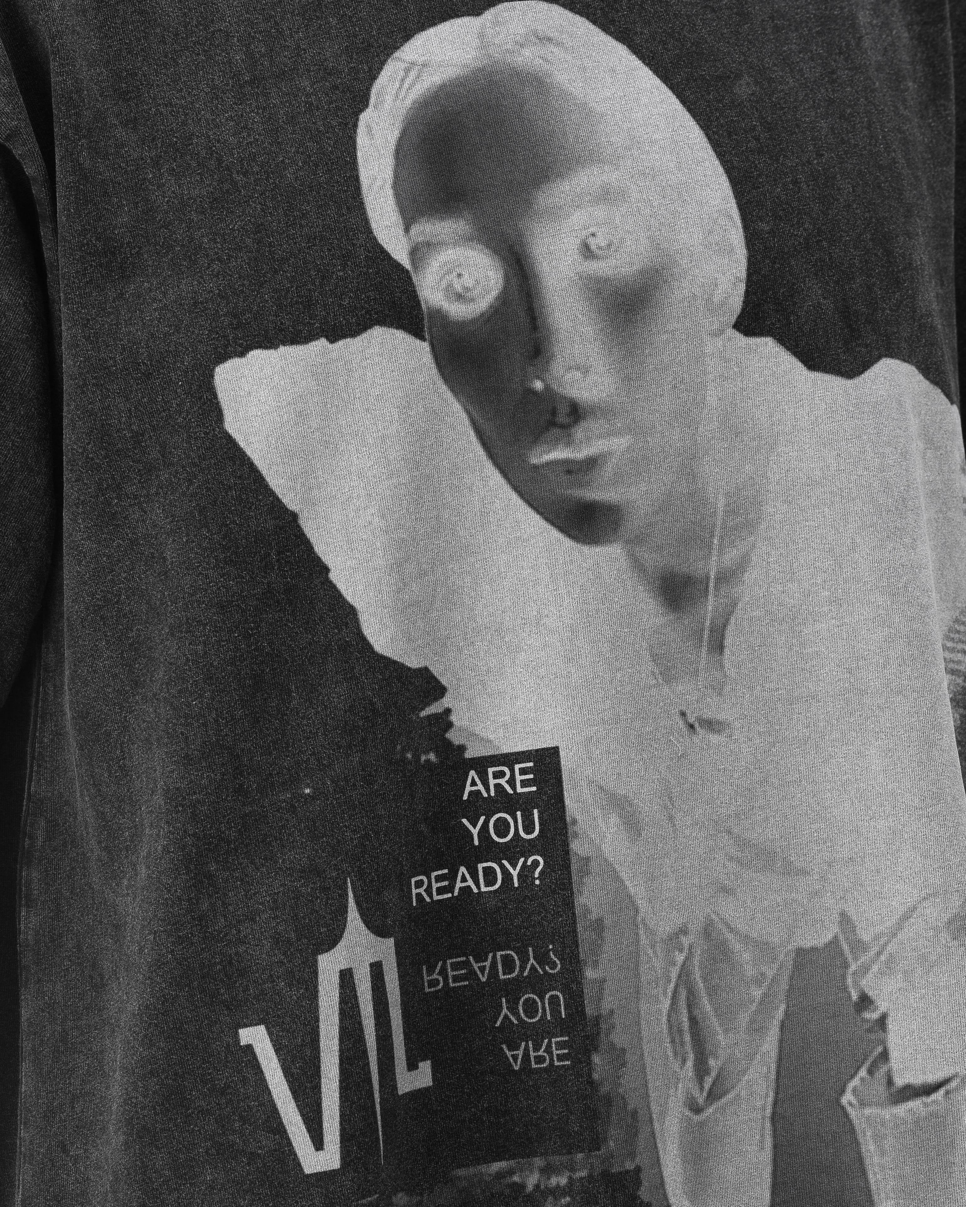 Close up of a Black Wash Acid T-shirt, with a print on the front of a lady's face with the Valeryia Lubchonak logo and phrases saying "Are you Ready?