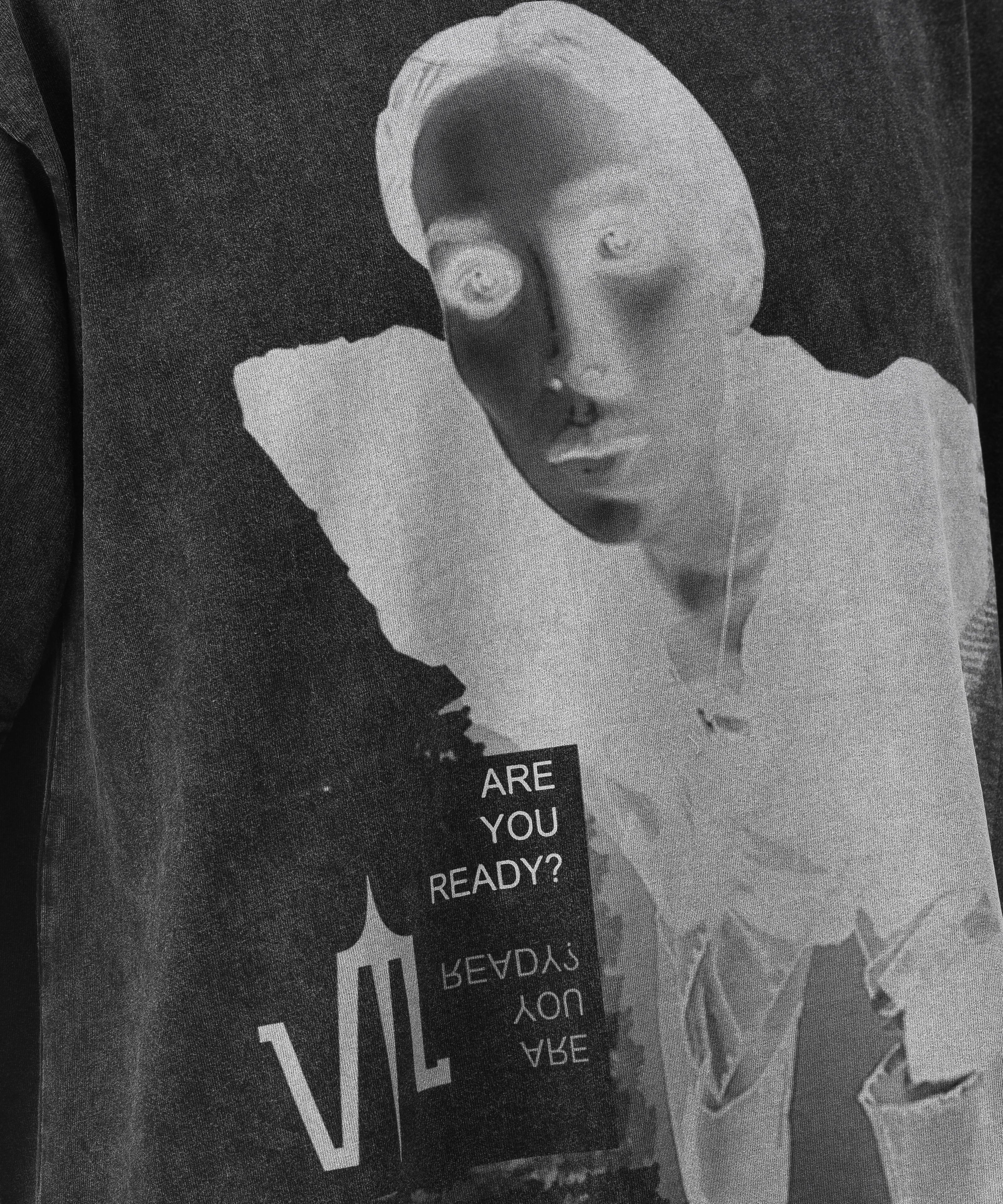 Close up of a Black Wash Acid T-shirt, with a print on the front of a lady's face with the Valeryia Lubchonak logo and phrases saying "Are you Ready?