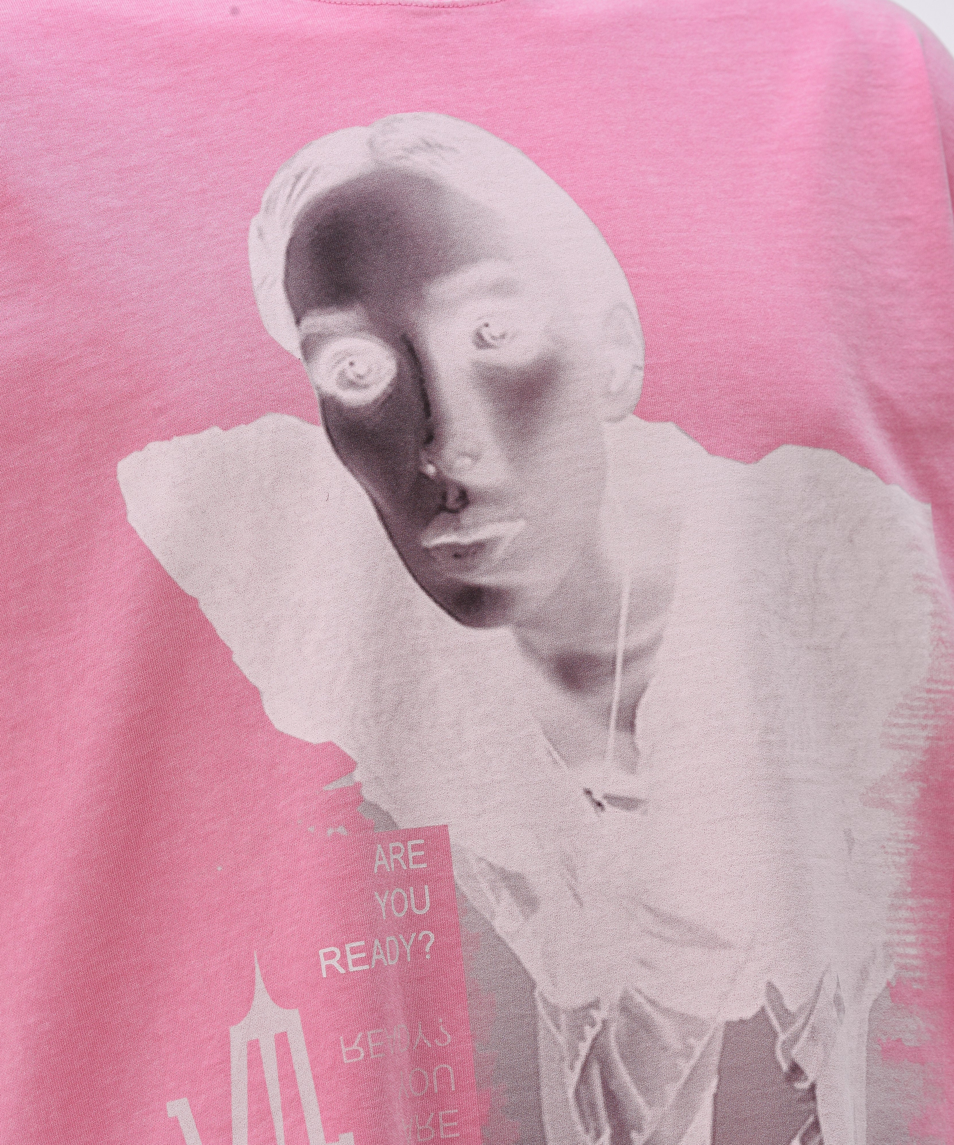 Close up of a Pink Wash Acid T-shirt, with a print on the front of a lady's face with the Valeryia Lubchonak logo and phrases saying "Are you Ready?